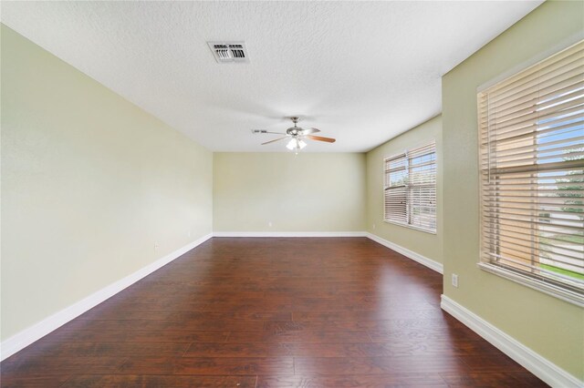 806 Sterling Spring Rd, Orlando, FL 32828 - unfurnished room featuring a ceiling fan, wood finished floors, a textured ceiling, and baseboards