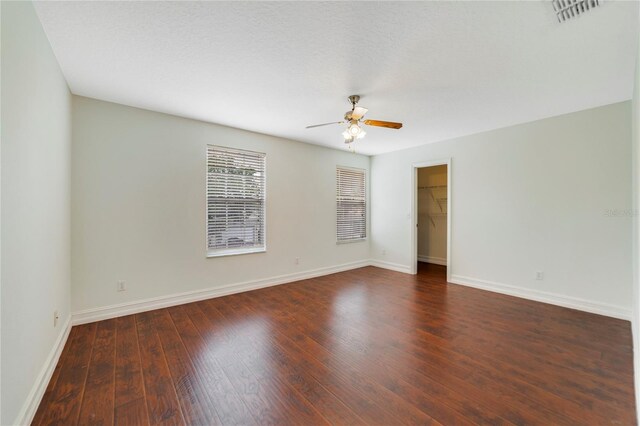 806 Sterling Spring Rd, Orlando, FL 32828 - unfurnished room with a ceiling fan, baseboards, and dark wood-style flooring