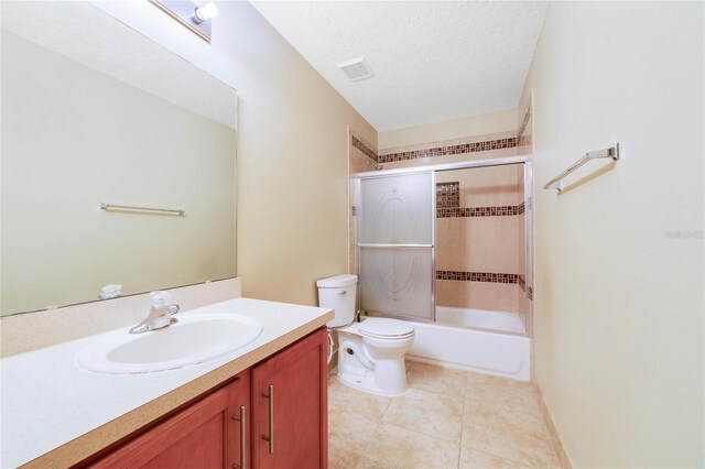 806 Sterling Spring Rd, Orlando, FL 32828 - full bath with toilet, vanity, shower / bath combination with glass door, and tile patterned floors