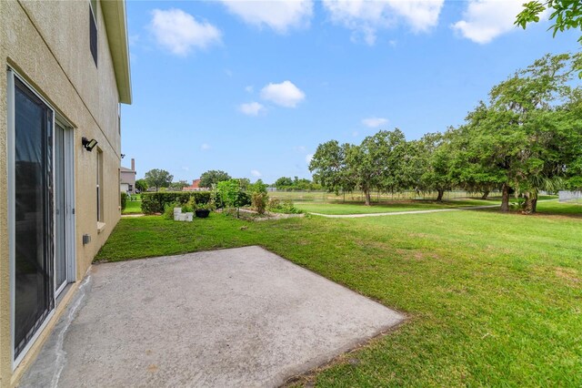806 Sterling Spring Rd, Orlando, FL 32828 - view of grassy yard with a patio