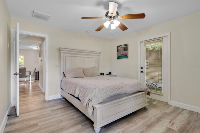 500 W Oakland Ave, Oakland, FL 34760 - bedroom featuring multiple windows, light wood-style flooring, and baseboards