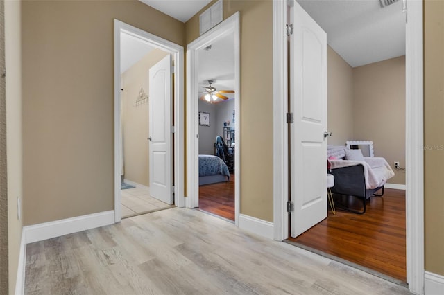 500 W Oakland Ave, Oakland, FL 34760 - corridor featuring wood finished floors and baseboards
