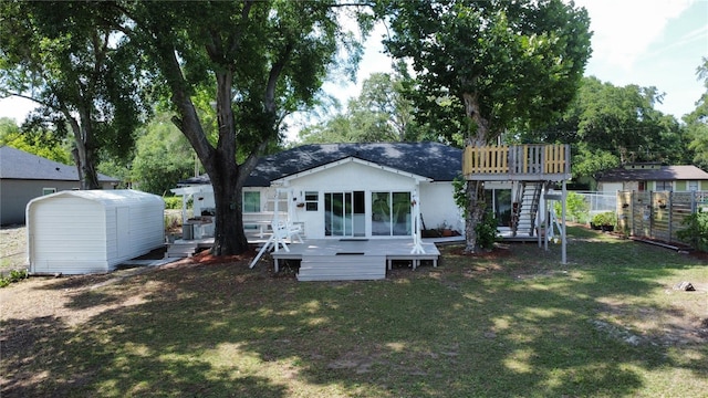 6428 Lynn Rd, Orlando, FL 32810 - back of house featuring a deck and stairs
