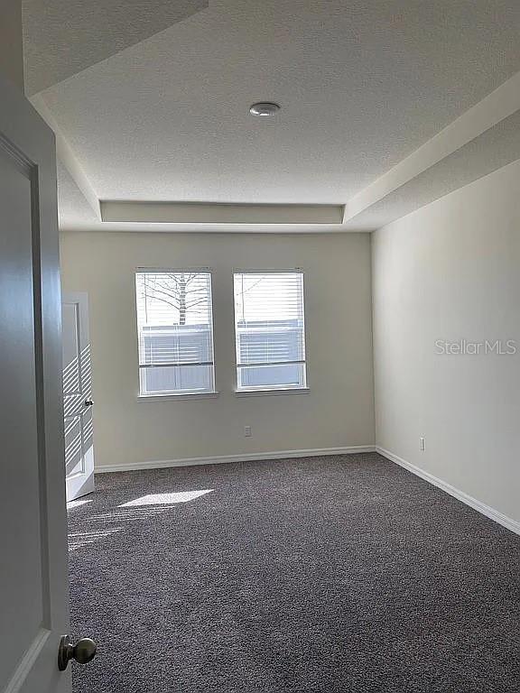 605 Big Pine Ave, Minneola, FL 34715 - carpeted empty room featuring baseboards