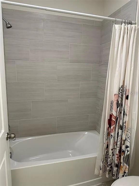 605 Big Pine Ave, Minneola, FL 34715 - bathroom with shower / bath combo and toilet