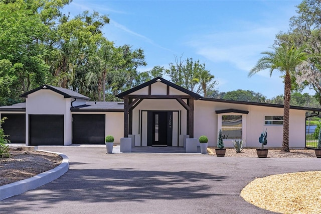 1700 Lake Markham Rd, Sanford, FL 32771 - view of building exterior featuring an attached garage and driveway