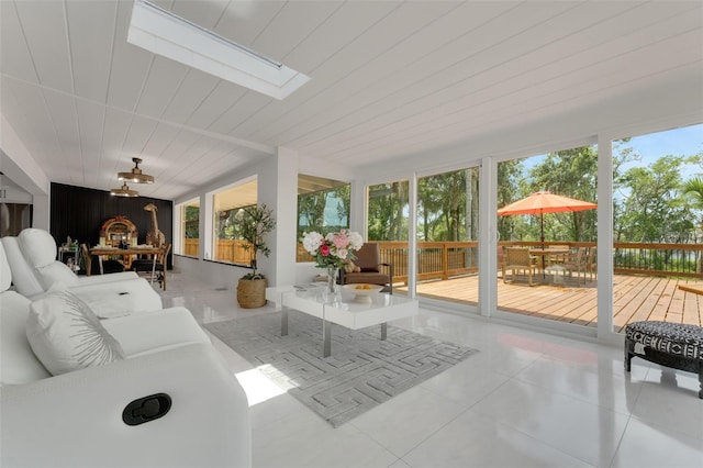 1700 Lake Markham Rd, Sanford, FL 32771 - sunroom with a skylight, a wooden deck, and tile patterned flooring