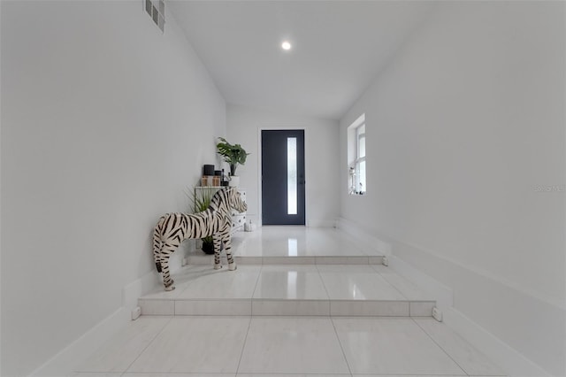 1700 Lake Markham Rd, Sanford, FL 32771 - entrance foyer featuring lofted ceiling, tile patterned floors, and baseboards
