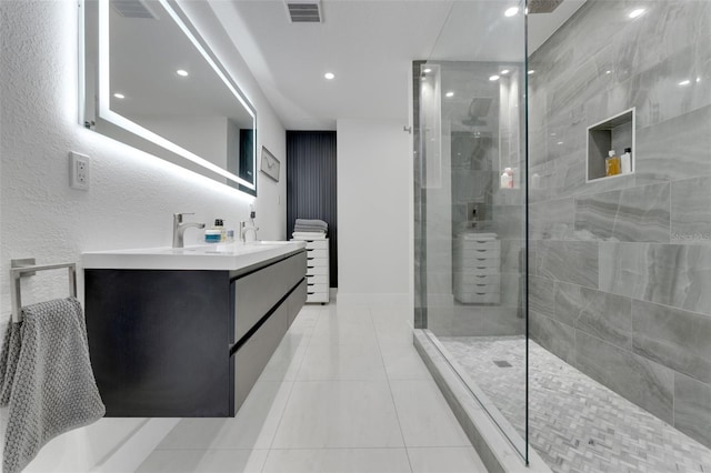 1700 Lake Markham Rd, Sanford, FL 32771 - bathroom featuring walk in shower, double vanity, tile patterned floors, recessed lighting, and baseboards