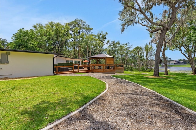 1700 Lake Markham Rd, Sanford, FL 32771 - view of grassy yard with a deck with water view and a gazebo