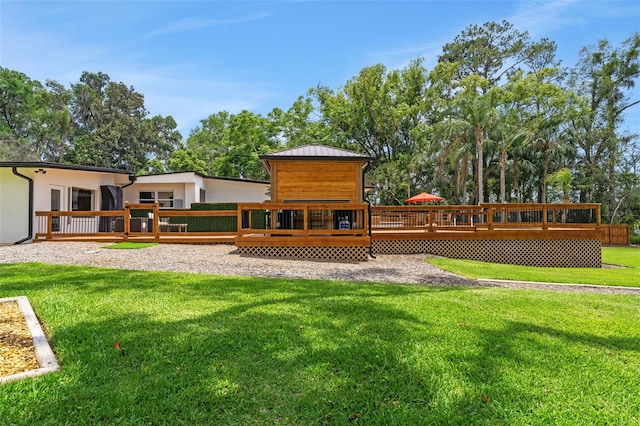 1700 Lake Markham Rd, Sanford, FL 32771 - back of house featuring a wooden deck and a lawn