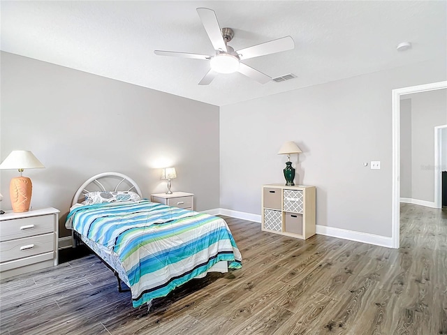 2124 Fish Eagle St, Clermont, FL 34714 - bedroom featuring wood finished floors, baseboards, and a ceiling fan