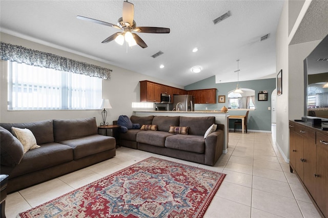 2729 Stanwood Dr, Kissimmee, FL 34743 - living area with a ceiling fan, light tile patterned floors, healthy amount of natural light, vaulted ceiling, and recessed lighting
