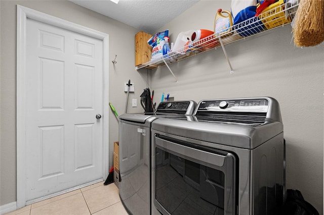 2729 Stanwood Dr, Kissimmee, FL 34743 - washroom featuring washer and dryer and light tile patterned flooring