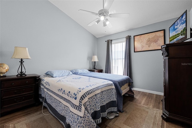 2729 Stanwood Dr, Kissimmee, FL 34743 - bedroom with wood finished floors, vaulted ceiling, baseboards, and ceiling fan