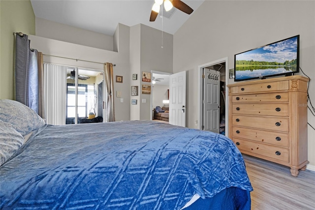 2729 Stanwood Dr, Kissimmee, FL 34743 - bedroom featuring light wood-style floors, high vaulted ceiling, and ceiling fan