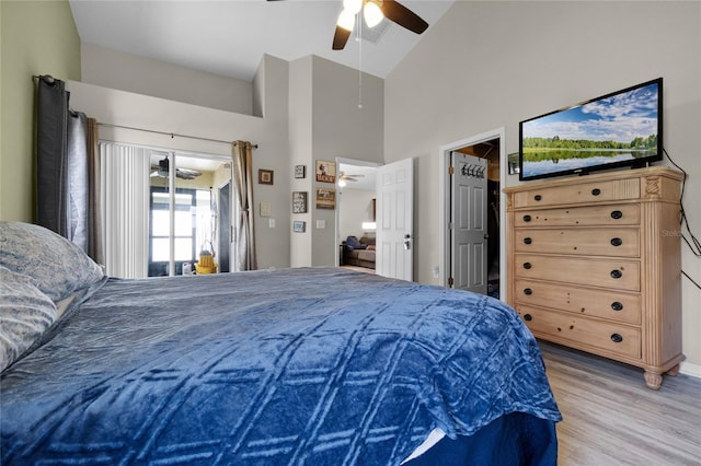 2729 Stanwood Dr, Kissimmee, FL 34743 - bedroom featuring light wood-style floors, high vaulted ceiling, a ceiling fan, and attic access