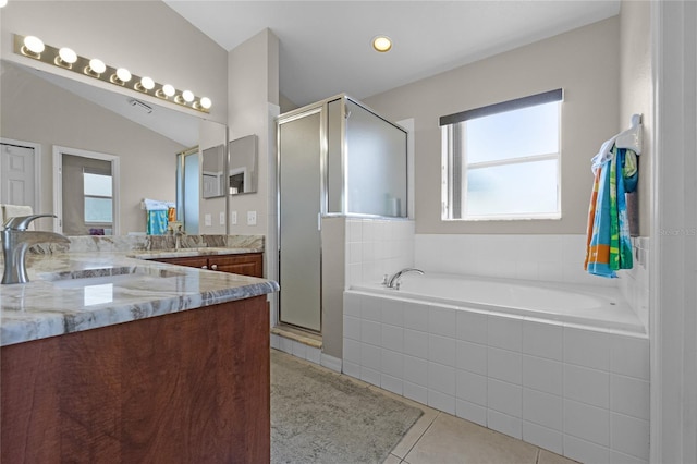 2729 Stanwood Dr, Kissimmee, FL 34743 - bathroom featuring vanity, healthy amount of natural light, a garden tub, and a stall shower