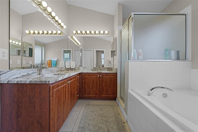 2729 Stanwood Dr, Kissimmee, FL 34743 - full bath with double vanity, a bath, tile patterned flooring, and a stall shower