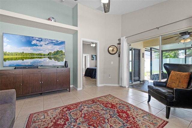 2729 Stanwood Dr, Kissimmee, FL 34743 - living room featuring ceiling fan, light tile patterned flooring, and baseboards