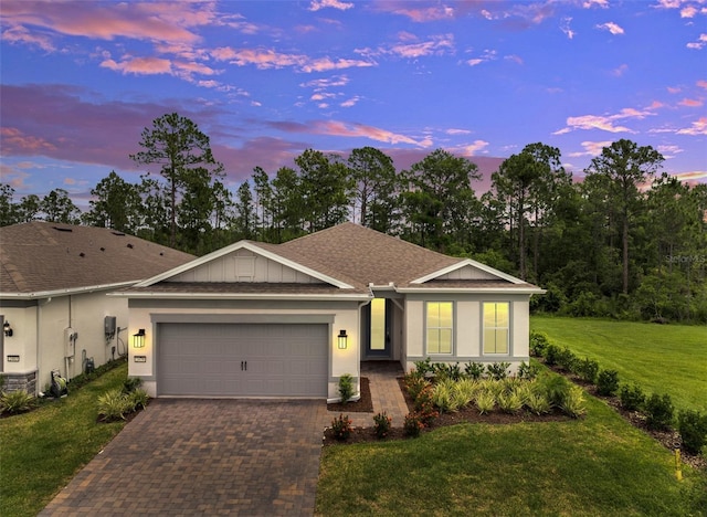 2479 Pine Preserve Ct, Saint Cloud, FL 34771 - ranch-style home with a garage, a front yard, driveway, and stucco siding