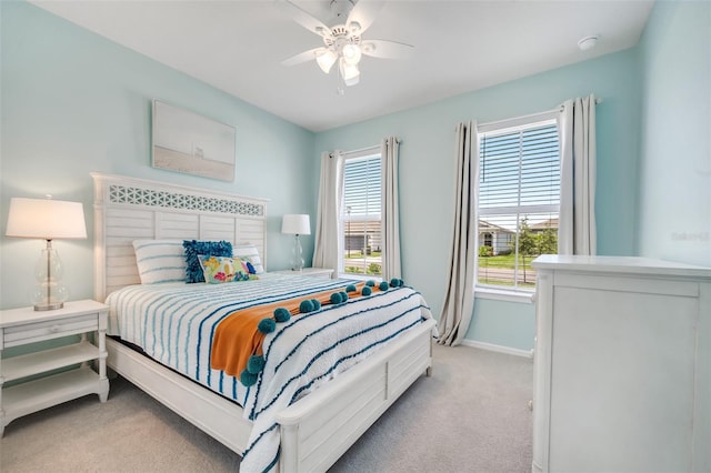 2479 Pine Preserve Ct, Saint Cloud, FL 34771 - bedroom featuring light carpet, baseboards, and ceiling fan