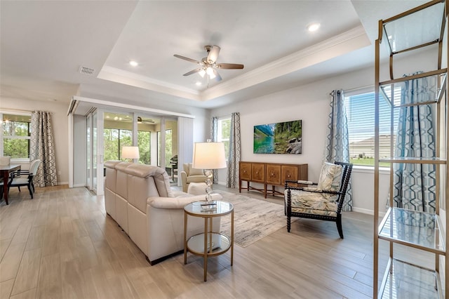 2479 Pine Preserve Ct, Saint Cloud, FL 34771 - living area with a ceiling fan, a raised ceiling, baseboards, recessed lighting, and ornamental molding