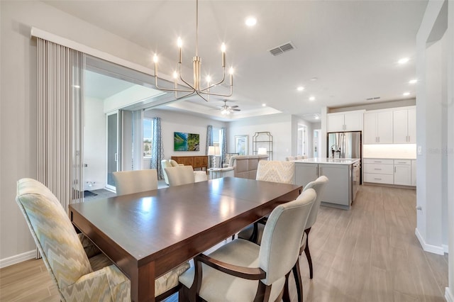 2479 Pine Preserve Ct, Saint Cloud, FL 34771 - dining room featuring ceiling fan, recessed lighting, baseboards, a chandelier, and light wood-style floors