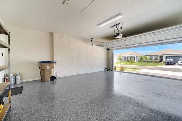 2479 Pine Preserve Ct, Saint Cloud, FL 34771 - garage featuring concrete block wall and a garage door opener