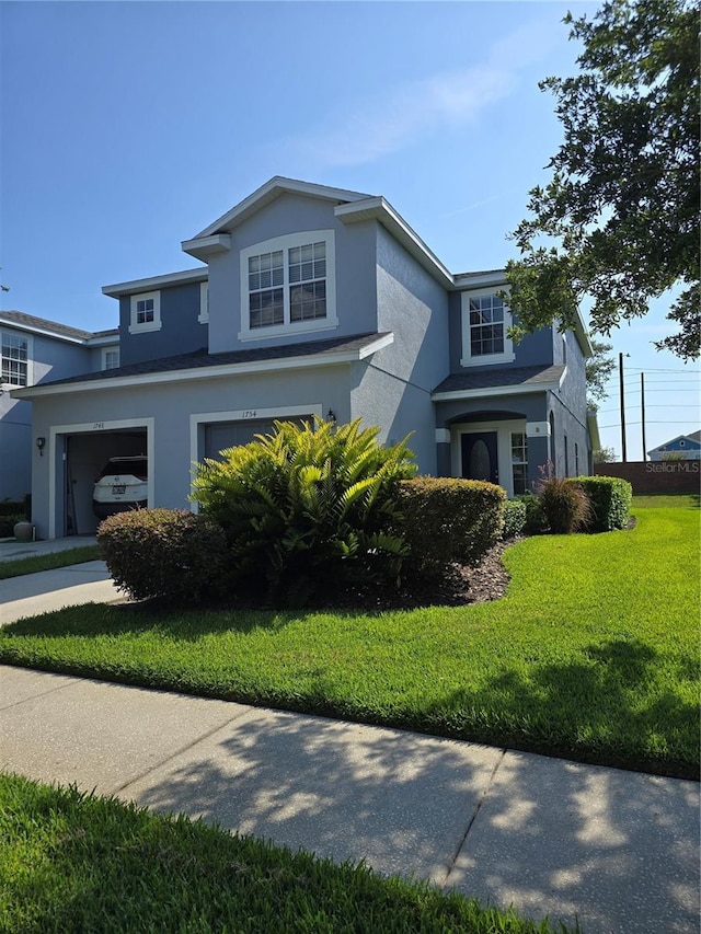 1754 Fritwell Ct, Ocoee, FL 34761 - traditional-style house featuring stucco siding, an attached garage, and a front lawn