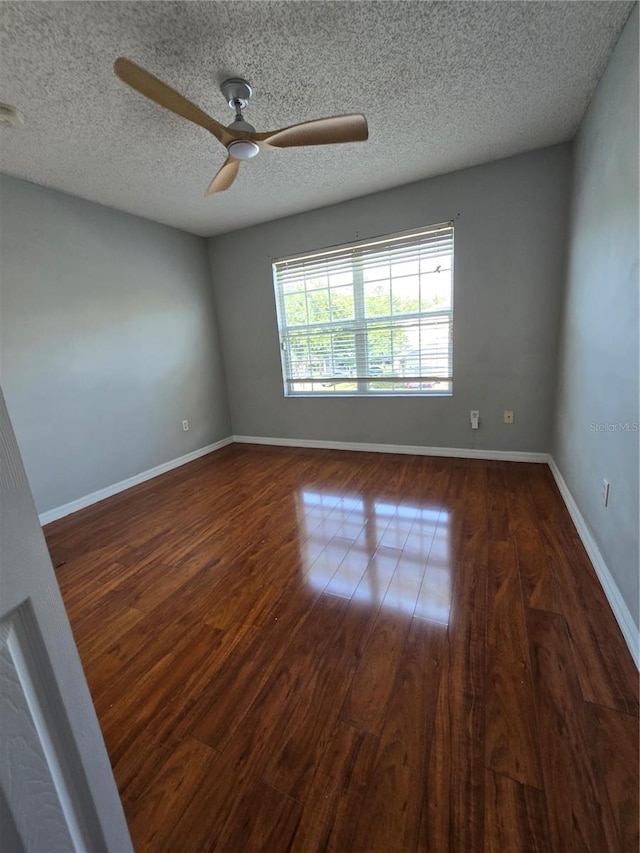 1754 Fritwell Ct, Ocoee, FL 34761 - unfurnished room featuring a ceiling fan, wood finished floors, a textured ceiling, and baseboards