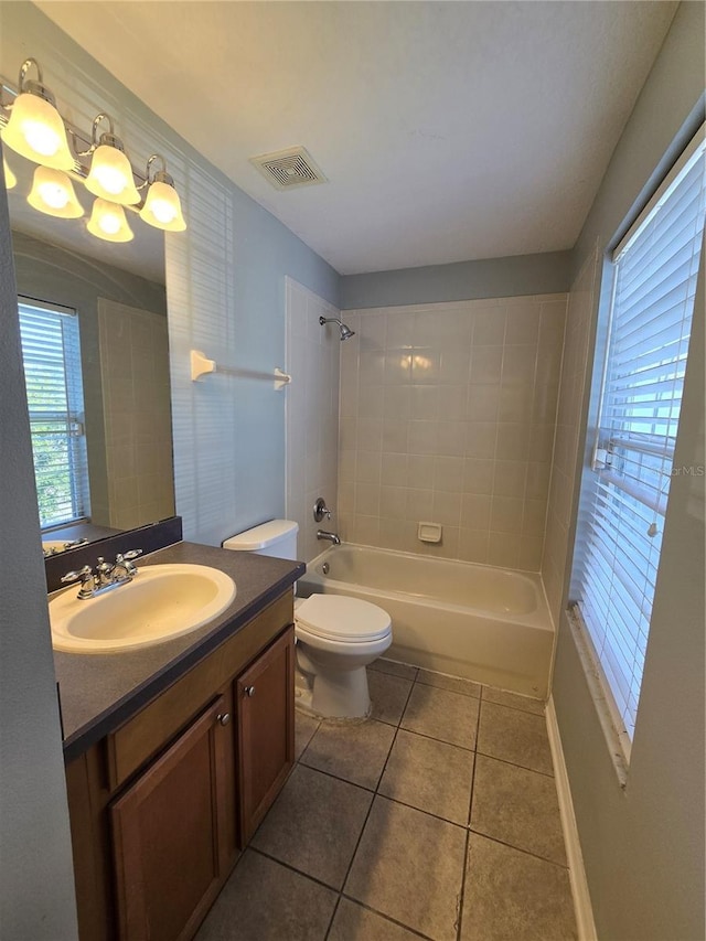 1754 Fritwell Ct, Ocoee, FL 34761 - bathroom featuring vanity, tile patterned flooring, toilet, and shower / bathtub combination