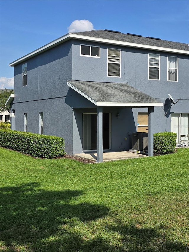 1754 Fritwell Ct, Ocoee, FL 34761 - rear view of property with a patio, a yard, and stucco siding