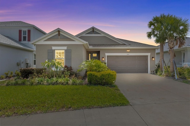 10516 Tranquil Meadow Loop, Riverview, FL 33569 - view of front facade with an attached garage, concrete driveway, stucco siding, and a front lawn