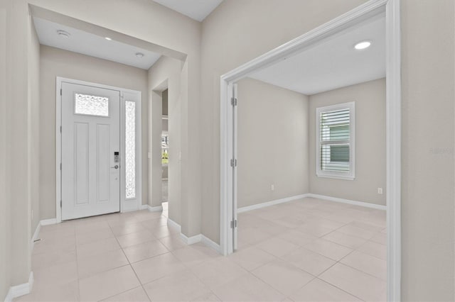 10516 Tranquil Meadow Loop, Riverview, FL 33569 - entryway featuring light tile patterned floors and baseboards