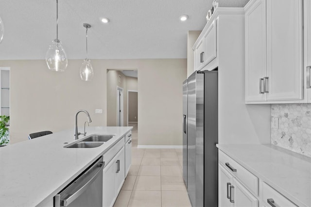 10516 Tranquil Meadow Loop, Riverview, FL 33569 - kitchen with stainless steel appliances, a sink, white cabinets, and tasteful backsplash