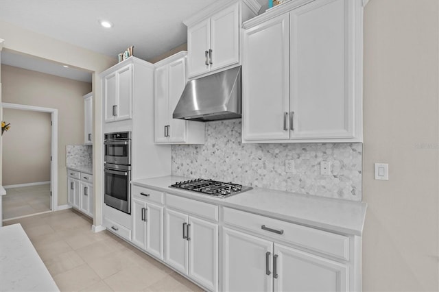 10516 Tranquil Meadow Loop, Riverview, FL 33569 - kitchen featuring under cabinet range hood, stainless steel appliances, light countertops, tasteful backsplash, and recessed lighting