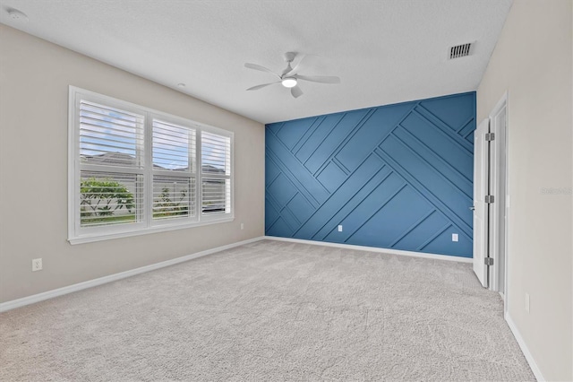 10516 Tranquil Meadow Loop, Riverview, FL 33569 - empty room with a ceiling fan, baseboards, carpet flooring, and a textured ceiling