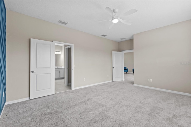 10516 Tranquil Meadow Loop, Riverview, FL 33569 - unfurnished bedroom featuring carpet floors, baseboards, ensuite bathroom, and ceiling fan