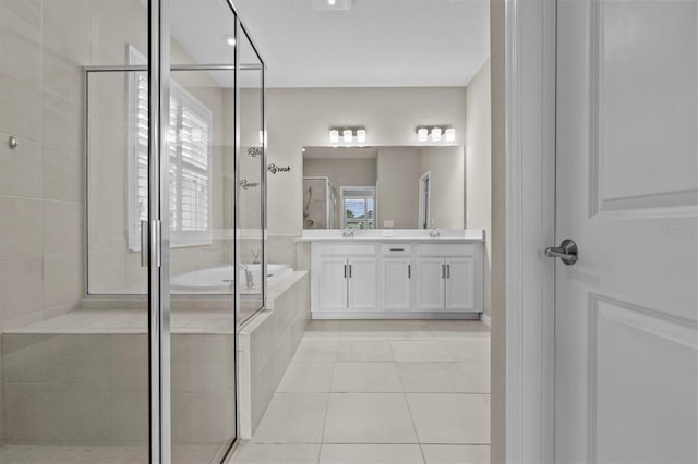 10516 Tranquil Meadow Loop, Riverview, FL 33569 - bathroom with double vanity, a garden tub, and a shower stall