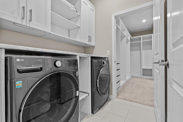 10516 Tranquil Meadow Loop, Riverview, FL 33569 - laundry room featuring washer and dryer, light colored carpet, cabinet space, and light tile patterned floors