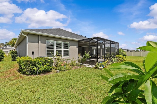 10516 Tranquil Meadow Loop, Riverview, FL 33569 - rear view of property featuring stucco siding, a patio, glass enclosure, and roof with shingles