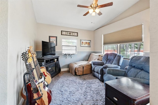 1111 Liberty Ave, Mount Dora, FL 32757 - living room with lofted ceiling, ceiling fan, wood finished floors, and baseboards