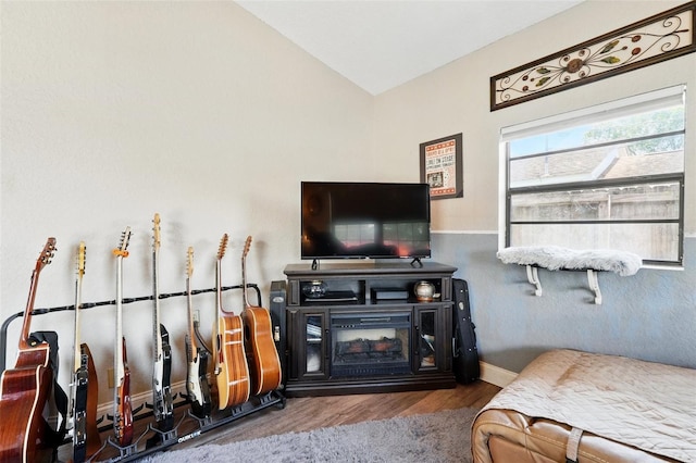 1111 Liberty Ave, Mount Dora, FL 32757 - living area with wood finished floors, vaulted ceiling, and baseboards