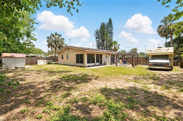 1111 Liberty Ave, Mount Dora, FL 32757 - back of property featuring a fenced backyard and a patio area