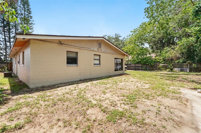 1111 Liberty Ave, Mount Dora, FL 32757 - view of property exterior featuring cooling unit and concrete block siding