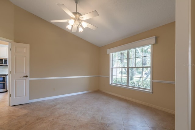 1947 Broadleaf Ct, Windermere, FL 34786 - spare room with vaulted ceiling, a ceiling fan, light tile patterned floors, and baseboards
