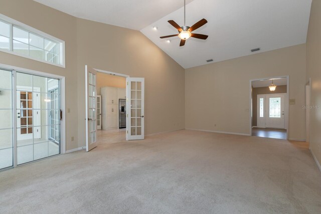 1947 Broadleaf Ct, Windermere, FL 34786 - carpeted empty room with french doors, high vaulted ceiling, ceiling fan, and baseboards