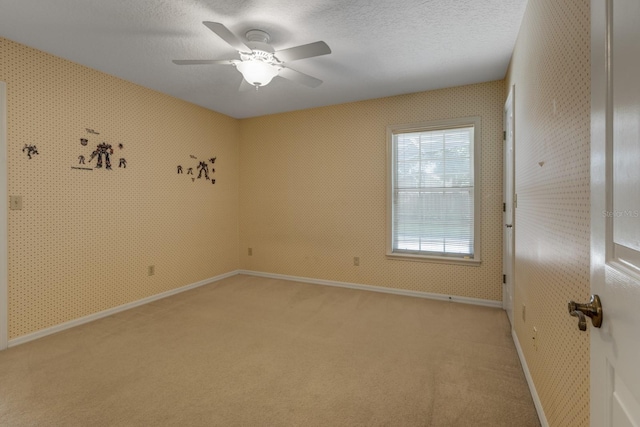 1947 Broadleaf Ct, Windermere, FL 34786 - unfurnished room with light carpet, a ceiling fan, a textured ceiling, baseboards, and wallpapered walls