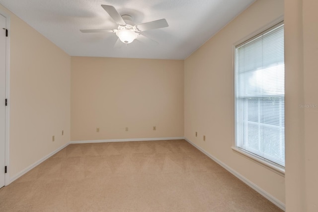 1947 Broadleaf Ct, Windermere, FL 34786 - spare room featuring light colored carpet, a ceiling fan, healthy amount of natural light, and baseboards